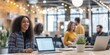 © WD Stock Photos - Professional woman smiling in a collaborative office environment