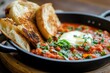 © Viktoriia - Savory dish featuring poached eggs in rich tomato sauce, garnish
