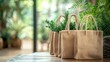 © Aulia - Eco-friendly bags on wooden table, plants in background, home or shop setting