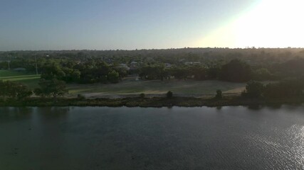 Wall Mural - Drone view of stunning agricultural fields on the bank of Swan River at sunset in Perth, Australia