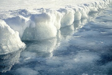 Fototapete - Ice formations along a frozen lake's edge, reflecting the winter light.