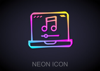 Wall Mural - glowing neon line laptop with music note symbol on screen icon isolated on black background. vector