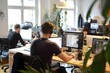 © Yuliana - Modern Office Workers Collaborate on Diverse Projects Using Computers and Headphones, Enhancing Productivity and Teamwork in a Creative Workspace.