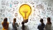 © Asih - Team brainstorming ideas around a large lightbulb sketch on a whiteboard.