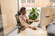 © ADDICTIVE STOCK - Professional office setting with focused employee at desk