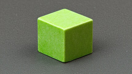 Canvas Print - Green cube on dark surface, geometric simplicity, design element