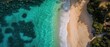 © SerPhoto - Stunning aerial view of a pristine beach meeting crystal clear waters in an untouched natural setting