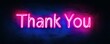 © Svitlana - Neon thank you sign glowing in pink and blue on dark wall background