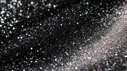 sparkling black and silver particles create a mesmerizing texture in a close-up view