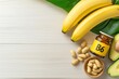 © Alexandre Patchine - Vitamin b6 supplements and natural sources like bananas, peanuts, and avocado are displayed on a white wooden table, providing essential nutrients for maintaining good health