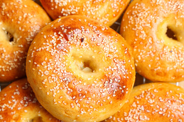 Wall Mural - Texture of tasty bagels with sesame seeds, closeup