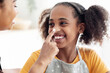 © Prostock-studio - Closeup portrait of black lady staining her smiling daughter nose with flour, cheerful afro-american mother and teen girl kid having fun while baking together at home, making pastry