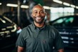 © NikoG - Smiling portrait of a middle aged African American car mechanic