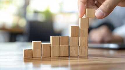 Poster - Businessman building increasing graph with wooden cubes on desk
