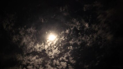 Wall Mural - Time lapse of a moon halo and high clouds in the night sky