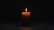 © napak - A single, flickering candle flame illuminates the darkness, a beacon of hope and remembrance in the quiet night