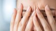 © Generative AI - A closeup of a woman experiencing stress and anxiety holding her forehead in deep thought with a pained expression : Generative AI