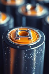 Poster - Close-up of metallic cylinder with orange industrial detail in sharp focus, surrounded by blurred background of other cylinders
