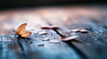 Poster - Close up view of a delicate dried leaf resting on wooden surface symbolizing change : Generative AI