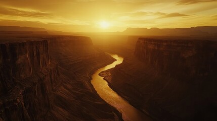 Wall Mural - Dramatic canyon landscape at dawn with a golden river flowing through majestic rock formations