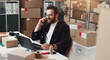 © peopleimages.com - Happy businessman, laptop or logistics with phone call for online order or customer service at storage warehouse. Man, distributor or employee talking with smile on mobile smartphone for distribution