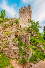 Fototapete - Arco castle ruins on cliffs above Garda lake, Trentino, Italy. Lago di garda