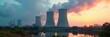 © intothestar - Imposing nuclear plant with colossal cooling towers , clouds, nuclear energy