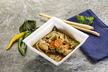 Wall Mural - Thai green curry soup with basil