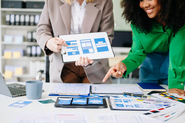 UX developer and ui designer brainstorming about mobile app interface wireframe design