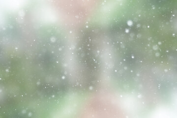 Wall Mural - blurred snow / winter abstract background, snowflakes on abstract blurred glowing leaf background