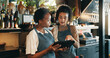 © WestLey/peopleimages.com - Restaurant, hotel and women on tablet for training for inventory, menu items and checklist by bar. Alcohol, business and waiter with manager on digital tech for hospitality, service and online order