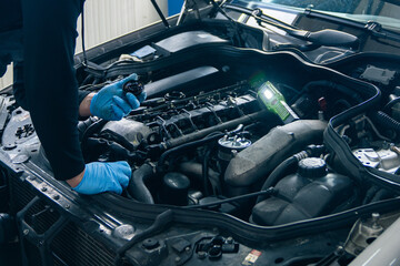 Poster - Serviceman repair car in car service