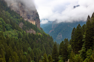 Wall Mural - sumela monastery with misty mountains. visit turkey concept