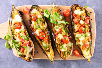 Wall Mural - baked eggplant stuffed with tomato, cheese and herbs