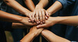 © Amazinglaive - A close-up of interlocked hands of women and men, different ages and ethnicities