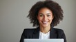 © Ankit - Smiling Professional Woman at Computer