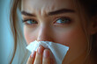 © lirida - Emotional portrait of a young woman expressing sadness and holding a tissue near her face