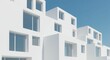 © Oxana39 - Modern minimalist white building with geometric architectural design against clear blue sky