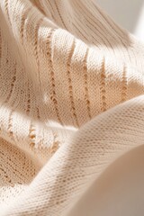 Poster - Structured beige knitted fabric showcases a beautiful geometric texture, with sharp lighting accentuating its depth and dynamic interplay of shadows across the surface