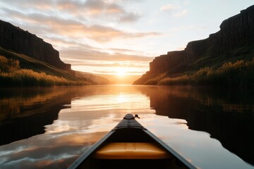 Wall Mural - Calm waters reflect the vibrant sunset over the canyon while kayaking along the river