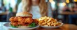 © Colors of N - Diet food loss weight concept, Hand of woman pushing fast food away and avoid to eat fried chicken to control cholesterol and sugar