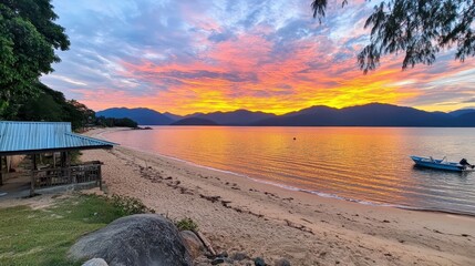 Poster - Sunrise over a tropical beach, soft golden light reflecting on calm water, light beige sand, and lush green vegetation along the shoreline, a small