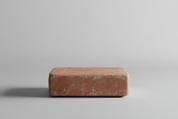 Canvas Print - Rough textured rectangular terracotta platform against a soft gray backdrop