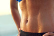 © peopleimages.com - Woman, abdomen and sweat with fitness outdoor of exercise, training and progress of weight loss. Female person, confidence and stomach with workout routine, wellness diet and abs results of body care