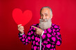 © deagreez - Photo of funky mature man cupid amour hold big paper heart shape indicating finger creative postcard wear stylish hearts pattern suit blazer shirt tie isolated red color background