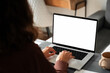 © Stock 4 You - Over shoulder view of female freelancer business woman working remotely, looking at white blank mockup laptop pc screen for advertising. Student doing ai search online for it work or studying at home