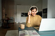 © Stock 4 You - Young smiling latin freelance businesswoman entrepreneur using computer app for remote business studying watching webinar. IT student woman working on laptop pc at home remotely, having online meeting