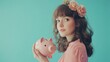 © Chayanin Wongpracha - young woman with piggy bank and flower crown
