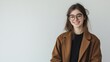 © xoan - Smiling woman, brown coat, white background, portrait