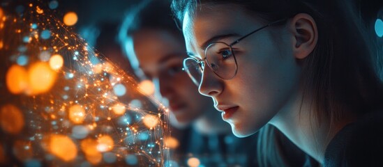 Women studying data streams, bokeh background, tech